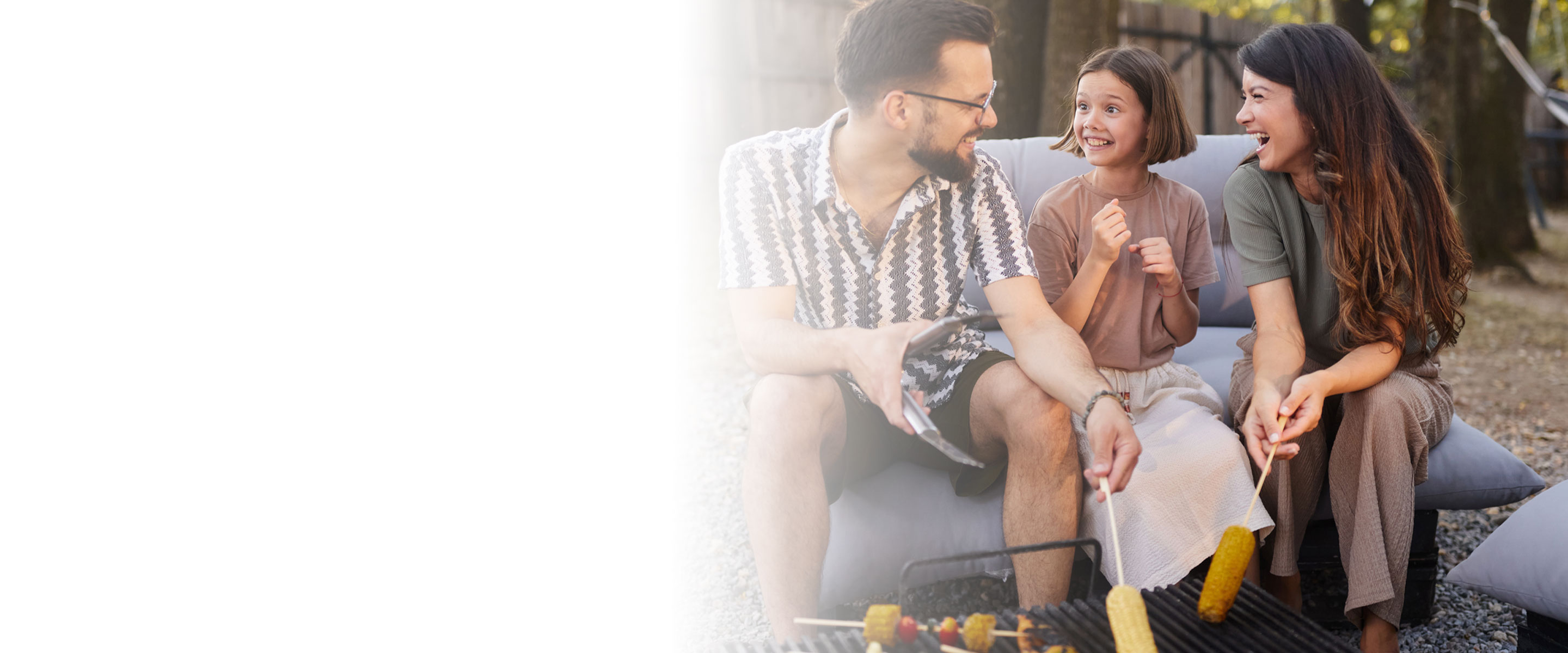 family outside grilling food
