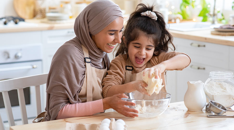 Mother and daughter baking