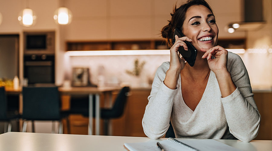 woman on phone smiling