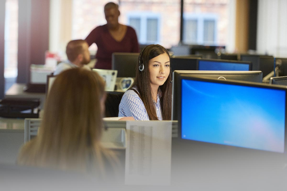 female service center employee at desk